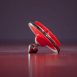 A red Chinese yo-yo (diabolo) close up